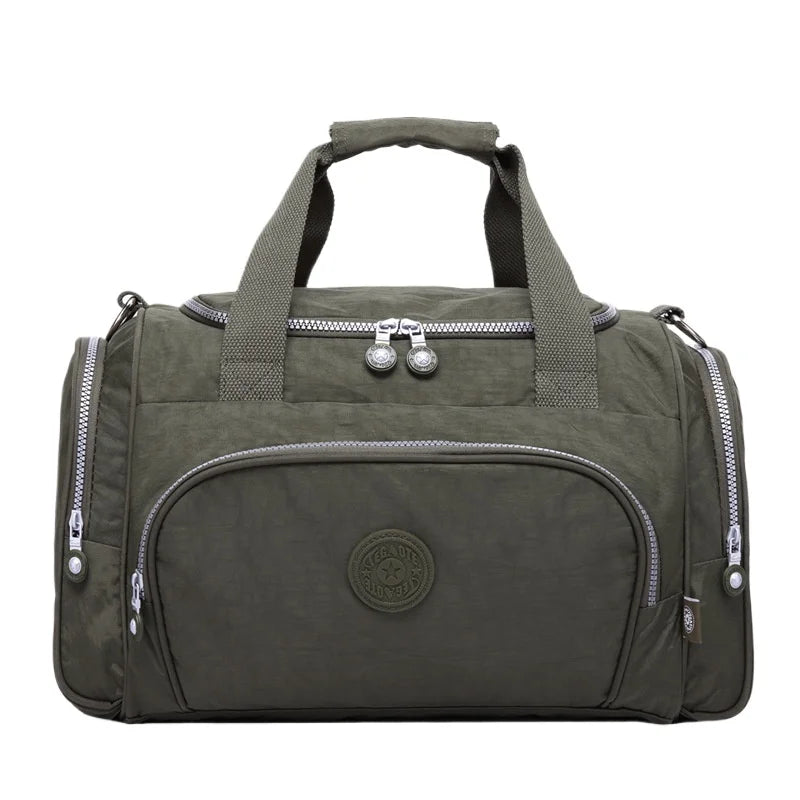 A dark olive green durable nylon travel duffle bag with padded straps and zippers.