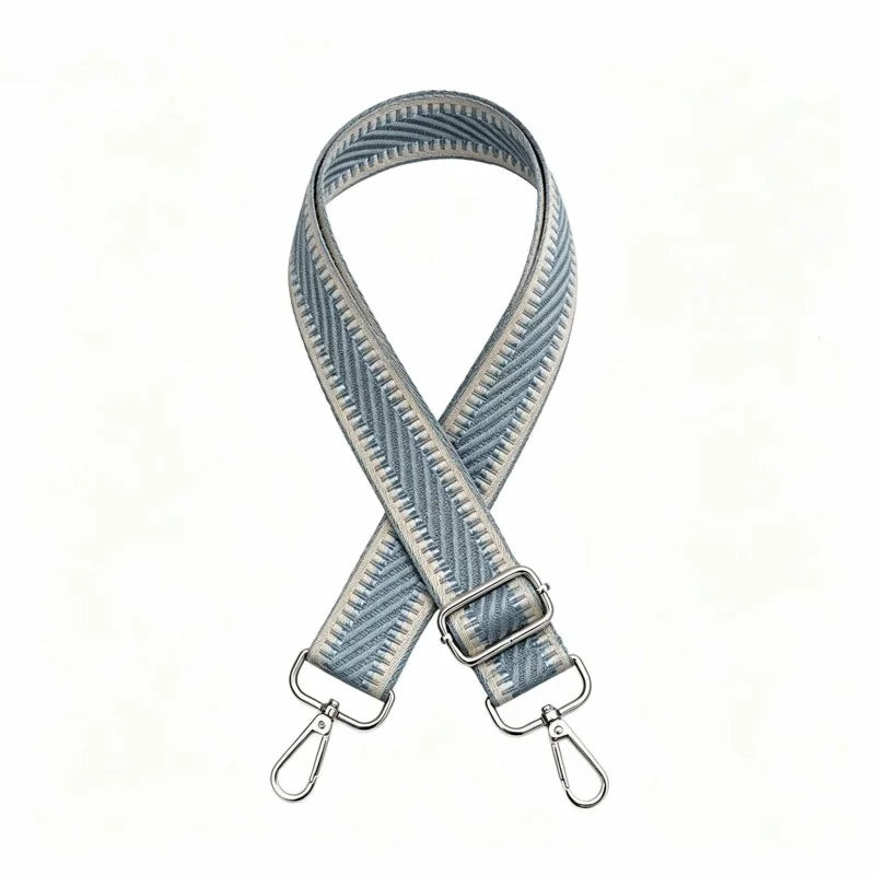 A beige nylon adjustable shoulder strap with a striped pattern shown against a white background.
