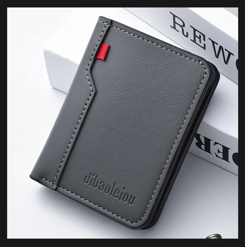 A dark gray ultra-thin PU leather credit card wallet is shown on a white surface.