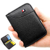 A black slim PU leather credit card wallet is held in a hand, showing the card slot and branding.