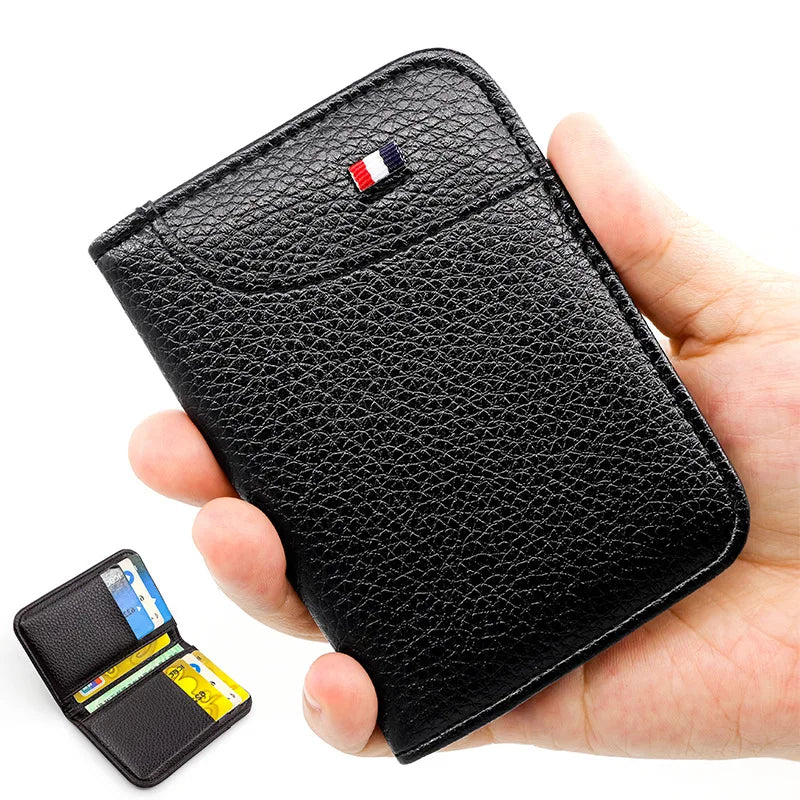 A black slim PU leather credit card wallet is held in a hand, showing the card slot and branding.