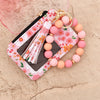 Llaveiro cartera de cuero PU de silicona floral rosa con borla y pulsera de cuentas