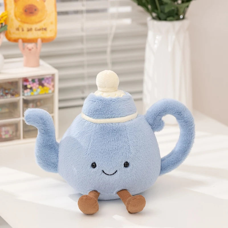 A light blue cartoon character plush toy with a handle sitting on a white surface.