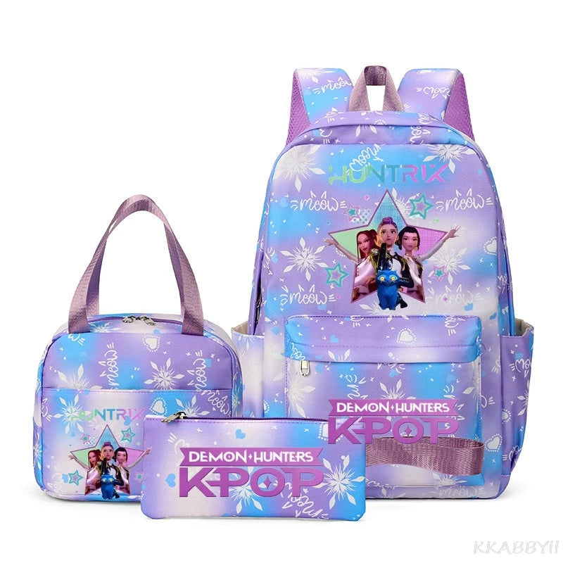 A purple multi-compartment backpack set featuring a unicorn design and demon hunters graphics.