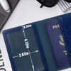 A dark blue leather passport holder wallet with a navy blue interior and gold embossed text is shown on a white surface.