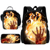A black backpack featuring a graphic of a hand engulfed in bright orange and yellow flames.