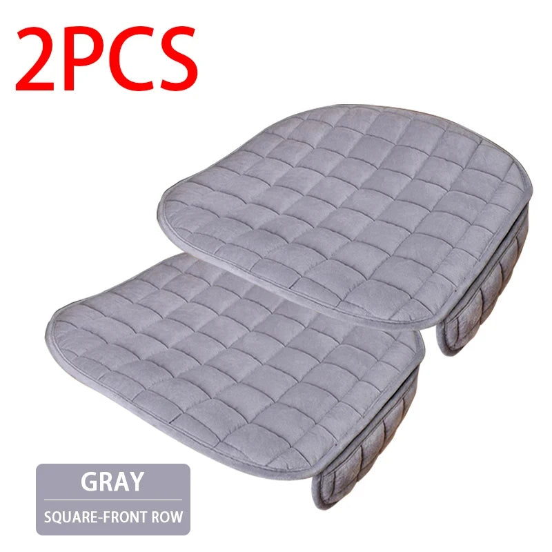 Two gray quilted square-front row car seat covers for protection and comfort.