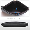 An open black PU leather clutch bag showing the inner zipper bag and primary position.