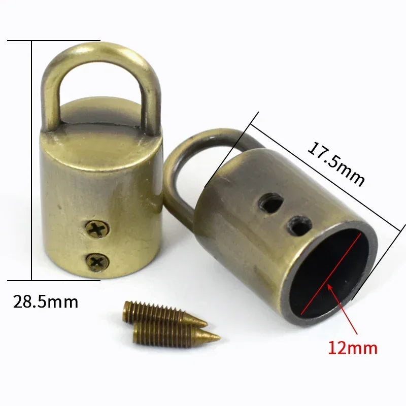 A brass metal cord lock buckle with a loop and a cylindrical body, shown next to a screw.