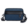 A navy blue men's PU leather crossbody bag with a black trim and adjustable strap.