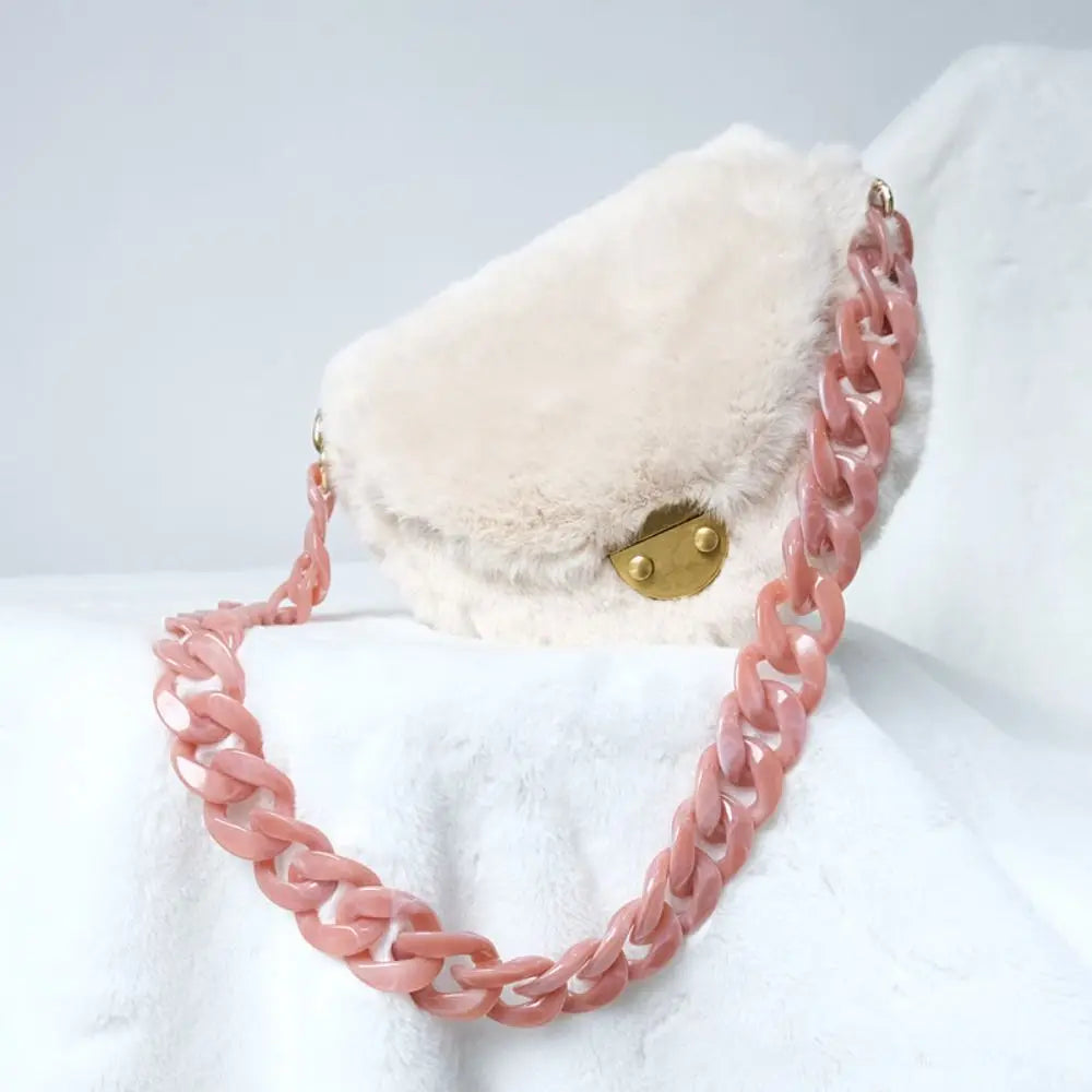 A light pink acrylic resin detachable bag chain strap is displayed against a white fluffy background.