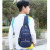 A young man wearing a white shirt and jeans is carrying a navy blue multi-functional nylon chest sling bag with yellow accent