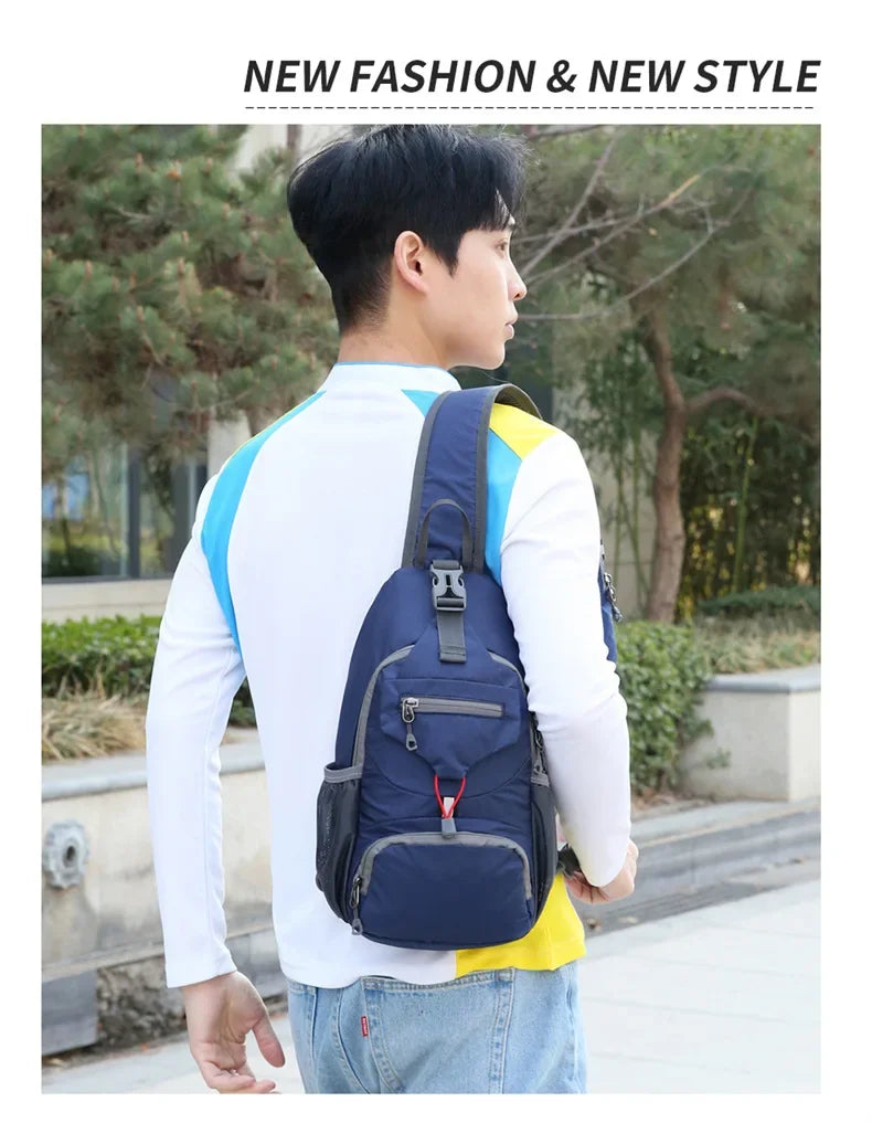 A young man wearing a white shirt and jeans is carrying a navy blue multi-functional nylon chest sling bag with yellow accent