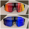 Un par de gafas de ciclismo UV400 con lente de gradiente naranja y rojo vibrante.