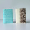 A pair of genuine leather passport holders featuring crocodile patterns in light blue and brown tones.
