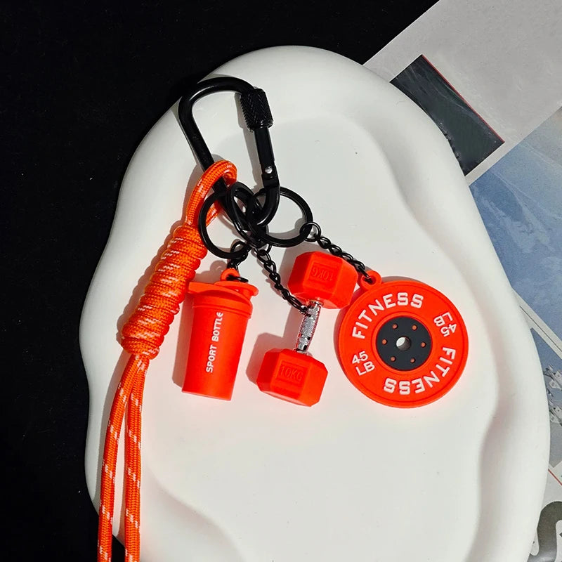 Orange and black D-shape nylon fitness keychain with a fitness weight and bottle attachment