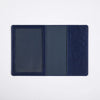 A dark navy blue leather passport holder wallet with three slots.