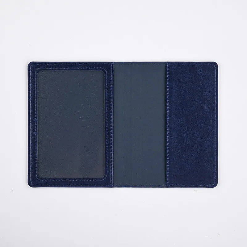 A dark navy blue leather passport holder wallet with three slots.