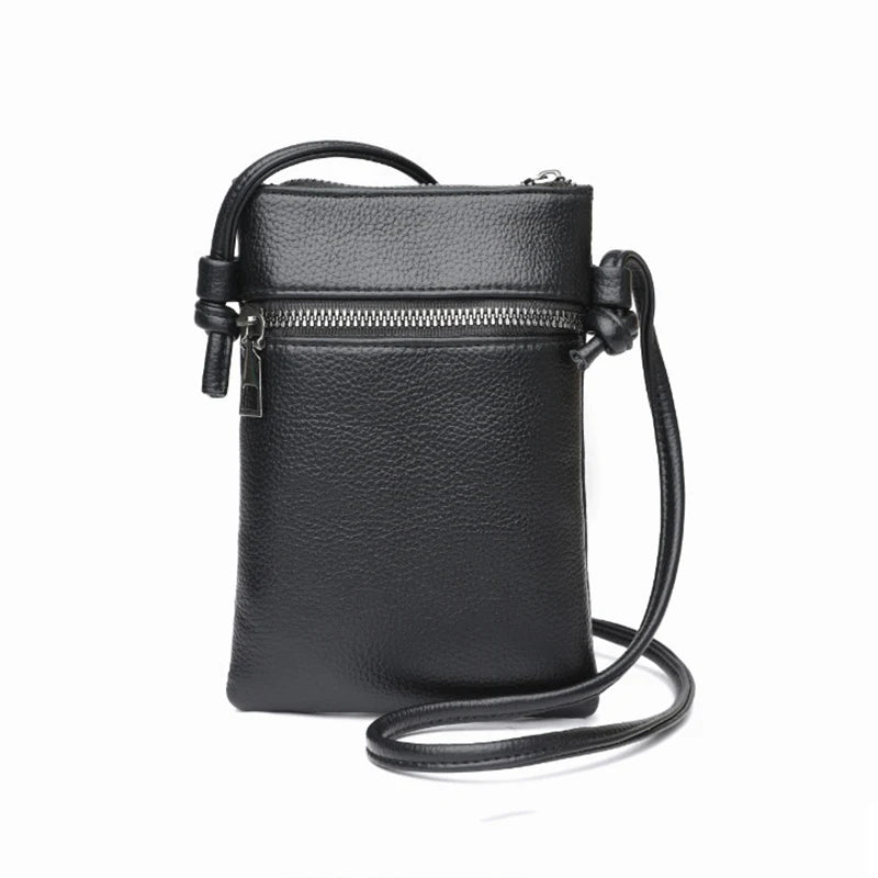 A black compact PU leather crossbody bag with a zipper and leather strap.