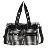 Black and white striped nylon shoulder bag with studded straps and pockets
