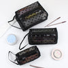 Three black mesh transparent makeup storage bags with gold and pink contents are displayed on a white background.