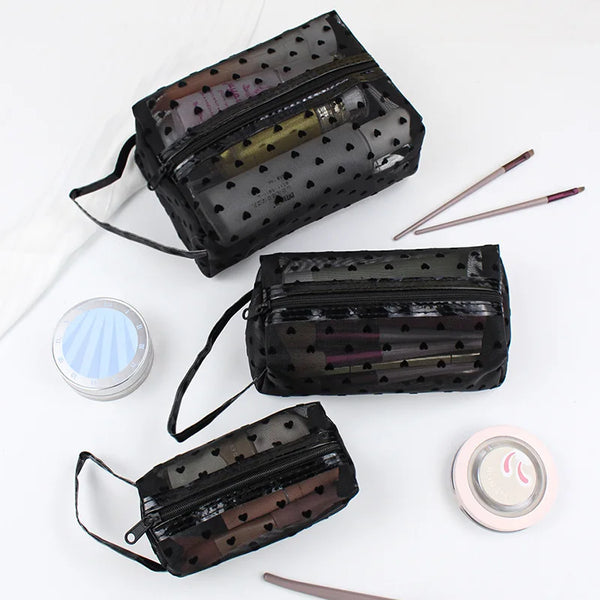 Three black mesh transparent makeup storage bags with gold and pink contents are displayed on a white background.
