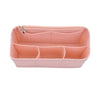 A pink felt insert liner designed to organize and protect items inside a handbag.