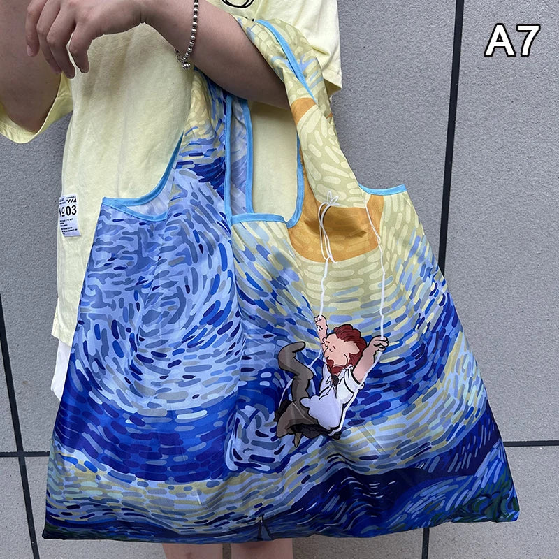 A yellow and blue patterned foldable nylon shopping tote with a shoulder strap.