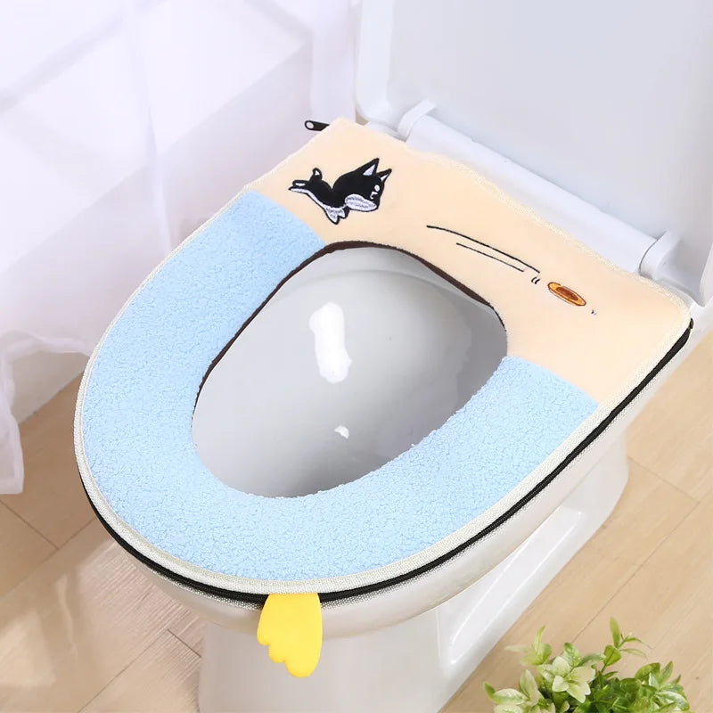 A plush waterproof toilet seat cover with a light yellow background and blue padding is shown inside a white toilet bowl.