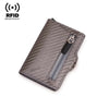 A dark gray slim wallet with a textured carbon fiber pattern and a zippered compartment.