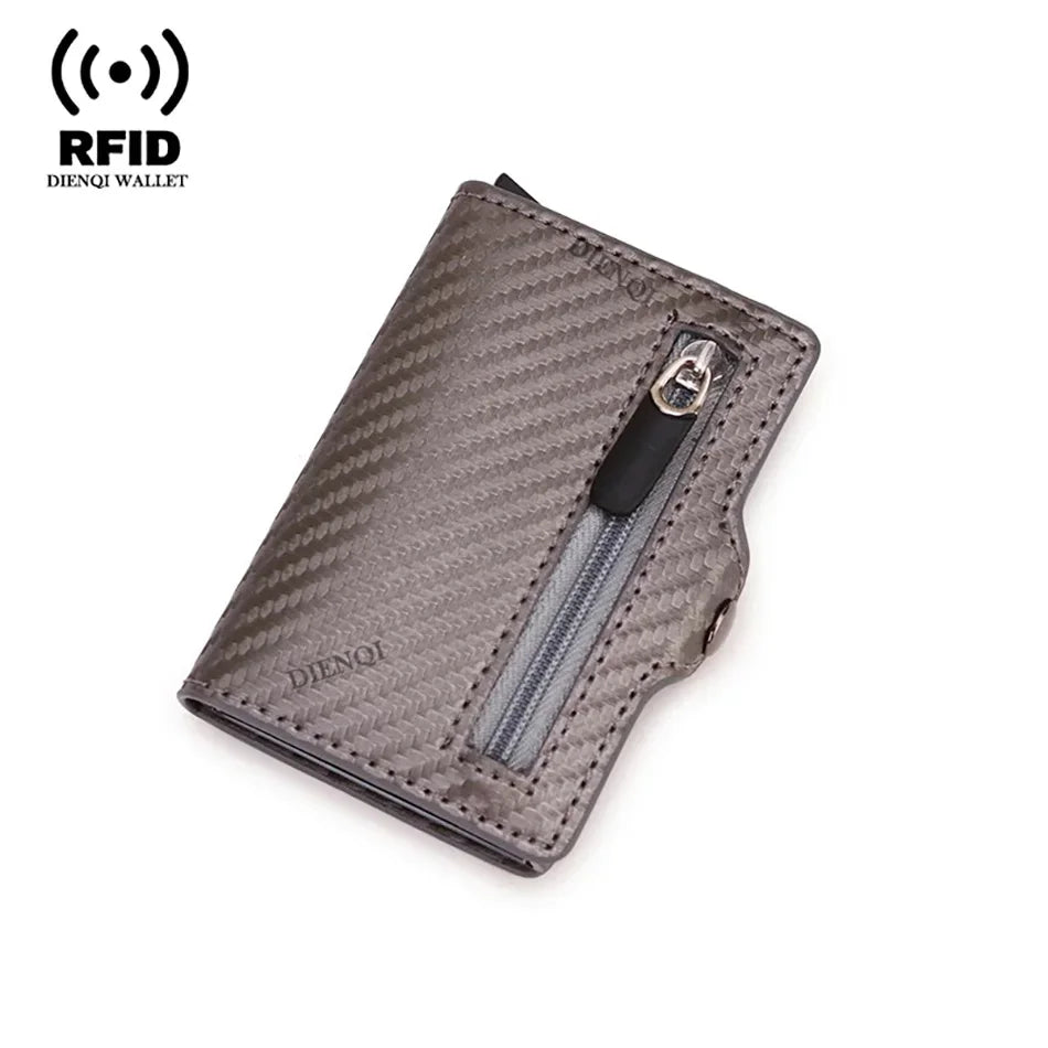 A dark gray slim wallet with a textured carbon fiber pattern and a zippered compartment.