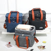Tres bolsas térmicas dobles y duraderas en azul marino, negro y gris sobre una superficie blanca.