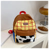A brown and yellow patterned backpack with a cow print fabric detail resting on a white surface.