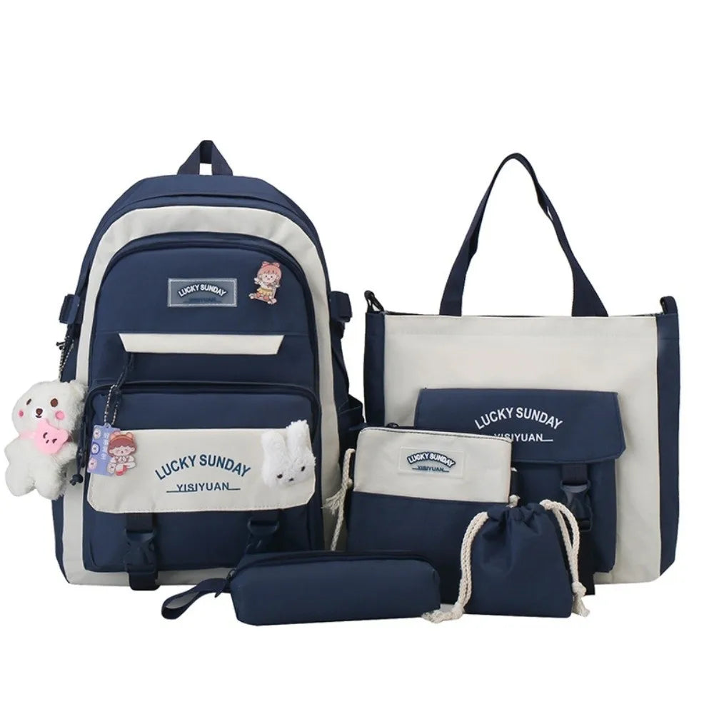 A set of five navy blue and cream nylon backpacks featuring a lucky sunday cartoon design.