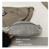 A silver rhinestone-embellished crossbody waist bag is shown next to a taupe blazer.