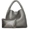 A silver-toned handwoven faux leather tote bag and matching clutch displayed together.