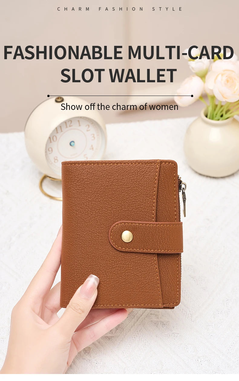 A brown multi-card slot wallet is held in a hand, displayed next to a clock and flowers.