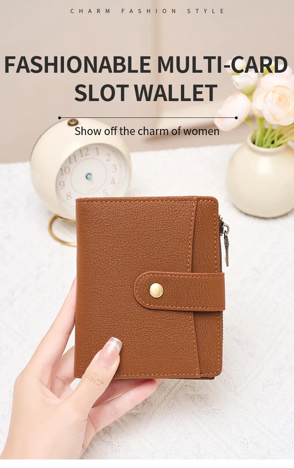 A brown multi-card slot wallet is held in a hand, displayed next to a clock and flowers.