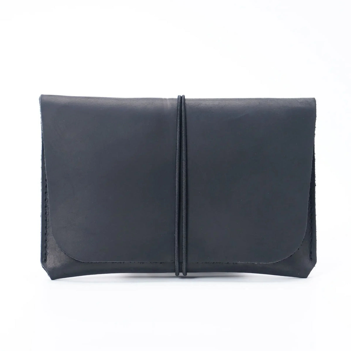 A dark gray minimalist full-grain leather passport holder and card wallet.