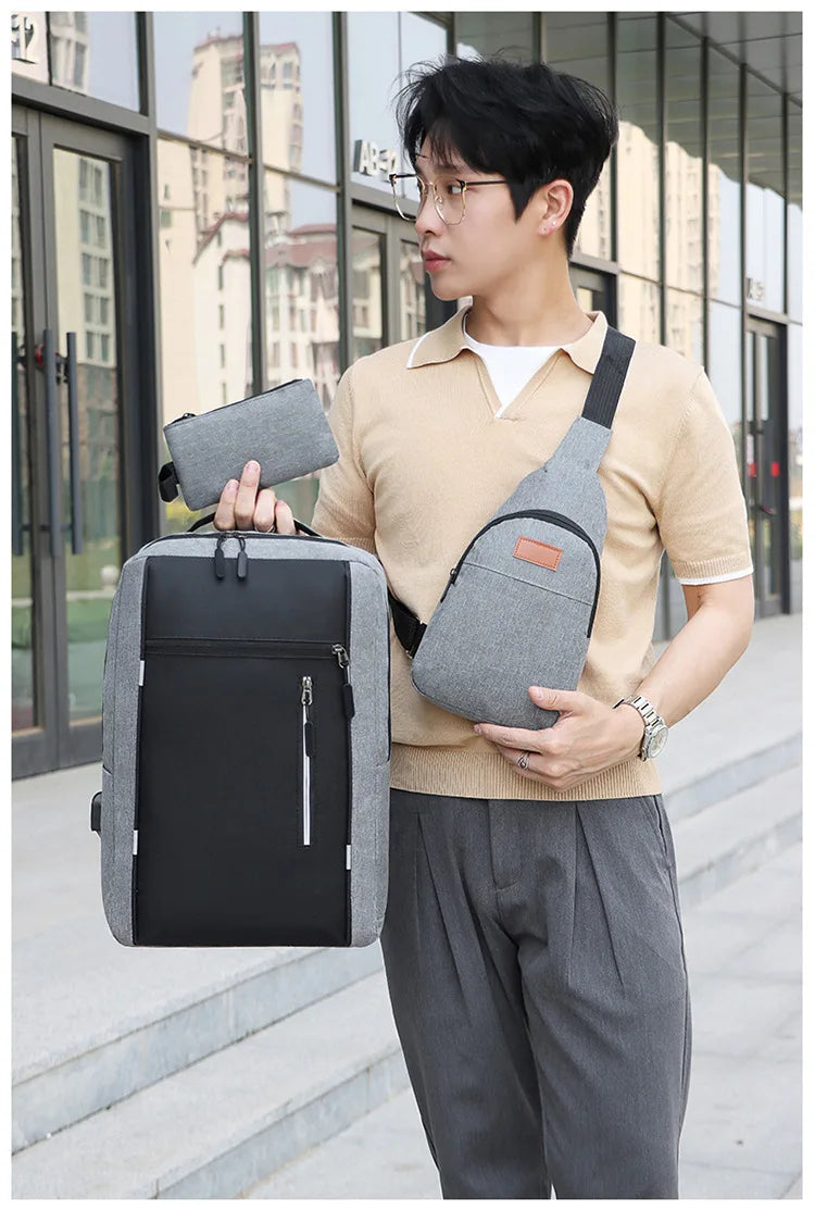 A young man wearing a beige sweater carries a gray backpack and a matching wallet.