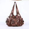 A brown vintage PU leather hobo shoulder bag with silver hardware displayed against a white background.