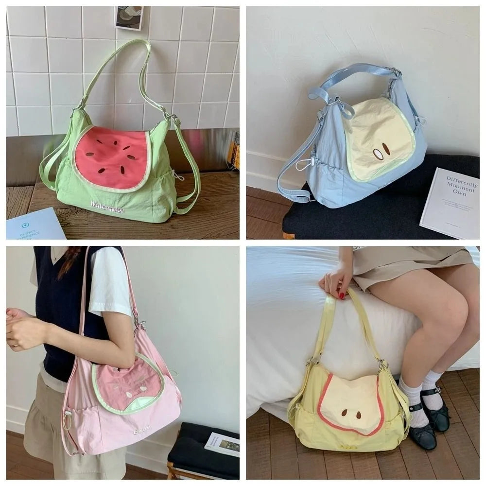 A light blue nylon messenger backpack with a yellow accent and pink trim is shown in various angles.