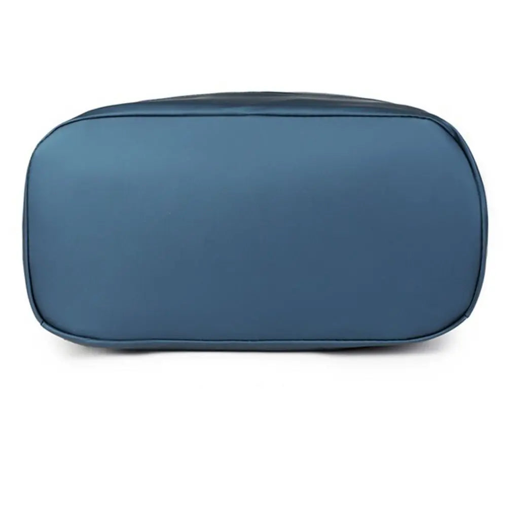 A dark blue waterproof business laptop backpack with a smooth, rounded rectangular shape.
