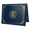 A dark blue leather certificate holder with gold embossing and a seal of the United States of America.