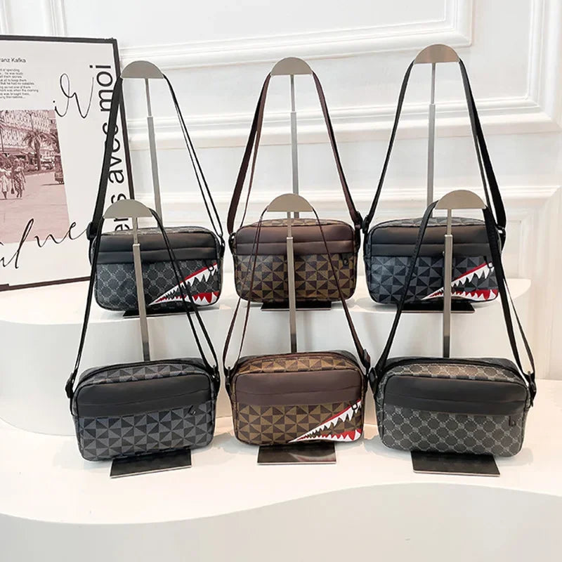 Three black leather crossbody coin purse and mobile phone bags displayed on a white surface.