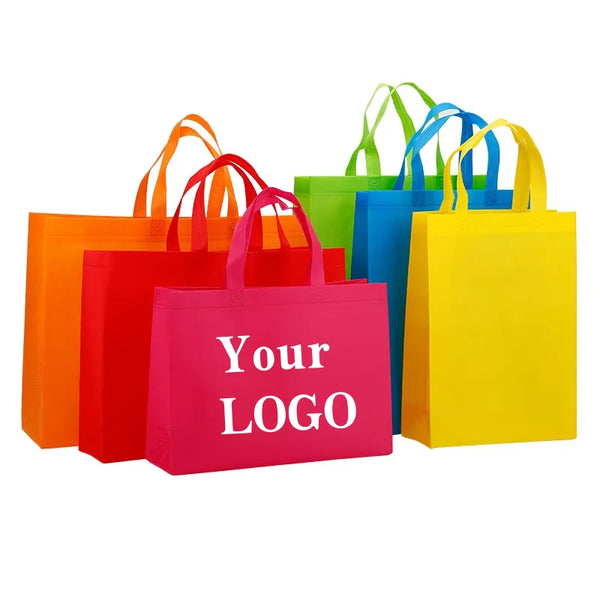 A collection of ten colorful non-woven shopping tote bags in various shades of orange, red, green, blue, and yellow.