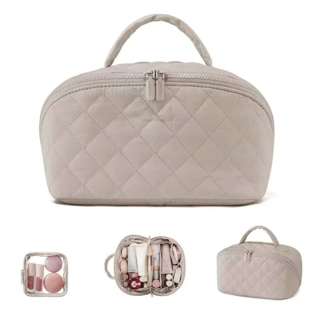 A light beige quilted makeup organizer bag with a handle, shown next to various makeup items.