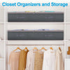 Three dark gray fabric storage bins and hangers displayed on white shelving.