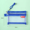 A transparent blue double-layer zipper pouch with a blue strap and a red tag, shown against a light green background.