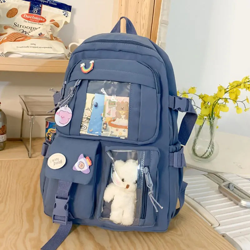 A navy blue Korean style large capacity women's backpack with various pockets and a padded laptop compartment